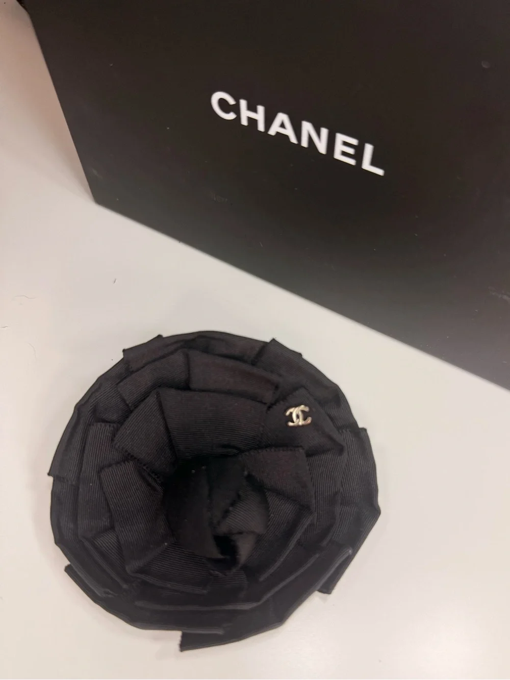 CHANEL Black Camellia Fabric Flower Pin with Gold CC Accent